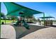Modern playground with shade structures and play equipment at 4505 Hummingbird Ln, Haines City, FL 33844