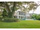 House with large backyard, lush lawn, and mature trees at 541 Virginia Dr, Winter Park, FL 32789