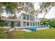 House with tiered lawn, pool, and patio at 541 Virginia Dr, Winter Park, FL 32789