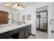 Modern bathroom with dark vanity, subway tile, and walk-in shower at 541 Virginia Dr, Winter Park, FL 32789