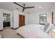 Bedroom with a king bed, built-in closet, and ensuite bathroom access at 541 Virginia Dr, Winter Park, FL 32789