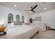 Spacious bedroom with king bed and sitting area, featuring natural light at 541 Virginia Dr, Winter Park, FL 32789