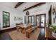 Elegant dining room with large wood table and access to backyard at 541 Virginia Dr, Winter Park, FL 32789