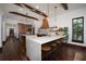 Modern kitchen with large island, custom cabinetry, and hardwood floors at 541 Virginia Dr, Winter Park, FL 32789