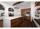 Modern kitchen features custom cabinetry, quartz countertops, and hardwood floors at 541 Virginia Dr, Winter Park, FL 32789