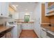 Bright laundry room with granite counters and built-in desk at 541 Virginia Dr, Winter Park, FL 32789