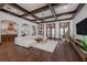 Open living space with hardwood floors, high ceilings, and kitchen views at 541 Virginia Dr, Winter Park, FL 32789