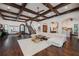 Bright and airy living room with hardwood floors and a stunning staircase at 541 Virginia Dr, Winter Park, FL 32789