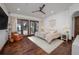 Spacious main bedroom with water views and a cozy sitting area at 541 Virginia Dr, Winter Park, FL 32789