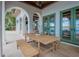 Outdoor dining area on patio with lake view at 541 Virginia Dr, Winter Park, FL 32789