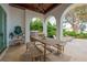 Outdoor kitchen and dining area with lake view at 541 Virginia Dr, Winter Park, FL 32789