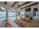 Relaxing patio with seating area, fireplace, and lake view at 541 Virginia Dr, Winter Park, FL 32789