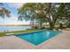 Inviting swimming pool with lake view and spacious deck at 541 Virginia Dr, Winter Park, FL 32789