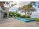 Stunning pool area with expansive patio and lake view at 541 Virginia Dr, Winter Park, FL 32789