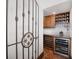 Well-appointed wine cellar with wine fridge and custom cabinetry at 541 Virginia Dr, Winter Park, FL 32789