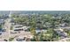 Aerial view showing a house's location on a tree-lined street near businesses at 616 W 1St St, Sanford, FL 32771