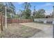 Large backyard with a wooden fence and a concrete patio at 616 W 1St St, Sanford, FL 32771