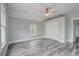 Spacious bedroom with hardwood floors and ceiling fan at 616 W 1St St, Sanford, FL 32771