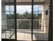 Private balcony overlooking a wooded area at 6413 Astor Village Ave # 314, Orlando, FL 32835