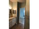 Clean bathroom with granite countertop and a bathtub at 6413 Astor Village Ave # 314, Orlando, FL 32835