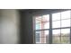 Bedroom with large window overlooking community at 6413 Astor Village Ave # 314, Orlando, FL 32835