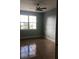 Bright bedroom with tile flooring and large windows at 6413 Astor Village Ave # 314, Orlando, FL 32835