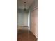 Hallway with light walls and tile flooring at 6413 Astor Village Ave # 314, Orlando, FL 32835