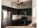 Modern kitchen with stainless steel appliances and granite countertops at 6413 Astor Village Ave # 314, Orlando, FL 32835