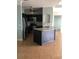 Modern kitchen featuring stainless steel appliances and an island at 6413 Astor Village Ave # 314, Orlando, FL 32835