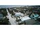 Aerial view of a two-story house near the beach in a neighborhood with palm trees at 821 E 1St Ave, New Smyrna Beach, FL 32169