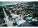 Aerial view of a coastal neighborhood with a focus on a charming house near the ocean at 821 E 1St Ave, New Smyrna Beach, FL 32169