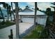 Single story home with driveway and tropical landscaping at 821 E 1St Ave, New Smyrna Beach, FL 32169