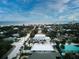 Aerial view showcasing a home's location near the ocean in a neighborhood with palm trees at 821 E 1St Ave, New Smyrna Beach, FL 32169
