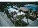 Aerial view of a charming coastal home with a white roof and lush landscaping at 821 E 1St Ave, New Smyrna Beach, FL 32169