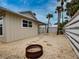 Charming backyard with fire pit and sand landscaping at 821 E 1St Ave, New Smyrna Beach, FL 32169