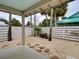 Landscaped backyard with sand, stone path, and wood fence at 821 E 1St Ave, New Smyrna Beach, FL 32169