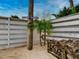 Backyard with wood pile and Mermaid Ave sign at 821 E 1St Ave, New Smyrna Beach, FL 32169