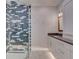Bathroom with walk-in shower and gray tile at 821 E 1St Ave, New Smyrna Beach, FL 32169