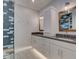 Modern bathroom with double vanity and walk-in shower at 821 E 1St Ave, New Smyrna Beach, FL 32169
