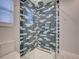 Bathroom with walk-in shower and gray tile at 821 E 1St Ave, New Smyrna Beach, FL 32169