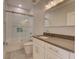 Modern bathroom with white vanity, grey countertop and glass shower at 821 E 1St Ave, New Smyrna Beach, FL 32169