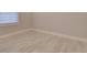 Empty bedroom with light grey walls and wood-look flooring at 821 E 1St Ave, New Smyrna Beach, FL 32169
