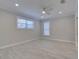 Bright bedroom with ceiling fan and light wood floors at 821 E 1St Ave, New Smyrna Beach, FL 32169