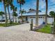 Single story home with white garage door and landscaping at 821 E 1St Ave, New Smyrna Beach, FL 32169
