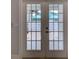 French doors leading to a private backyard patio at 821 E 1St Ave, New Smyrna Beach, FL 32169