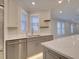 Modern kitchen with quartz countertops and gray cabinets at 821 E 1St Ave, New Smyrna Beach, FL 32169