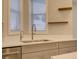 Modern kitchen sink and faucet with gray cabinets at 821 E 1St Ave, New Smyrna Beach, FL 32169