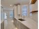 Modern kitchen with stainless steel appliances and white cabinets at 821 E 1St Ave, New Smyrna Beach, FL 32169