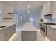 Open concept kitchen with island and stainless steel appliances at 821 E 1St Ave, New Smyrna Beach, FL 32169