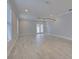 Spacious living room, hardwood floors, ceiling fan, and natural light at 821 E 1St Ave, New Smyrna Beach, FL 32169